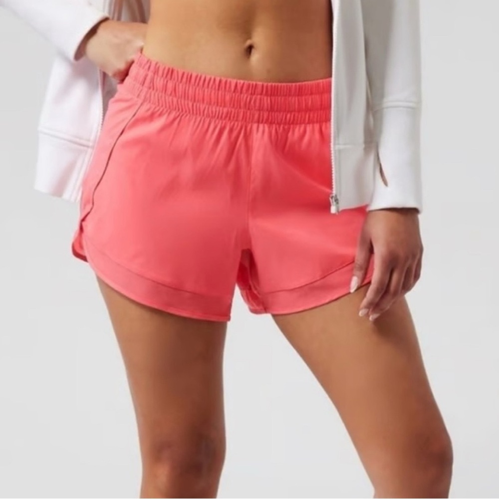Athleta salmon pink 4” Medium Athletic Shorts with draw string.